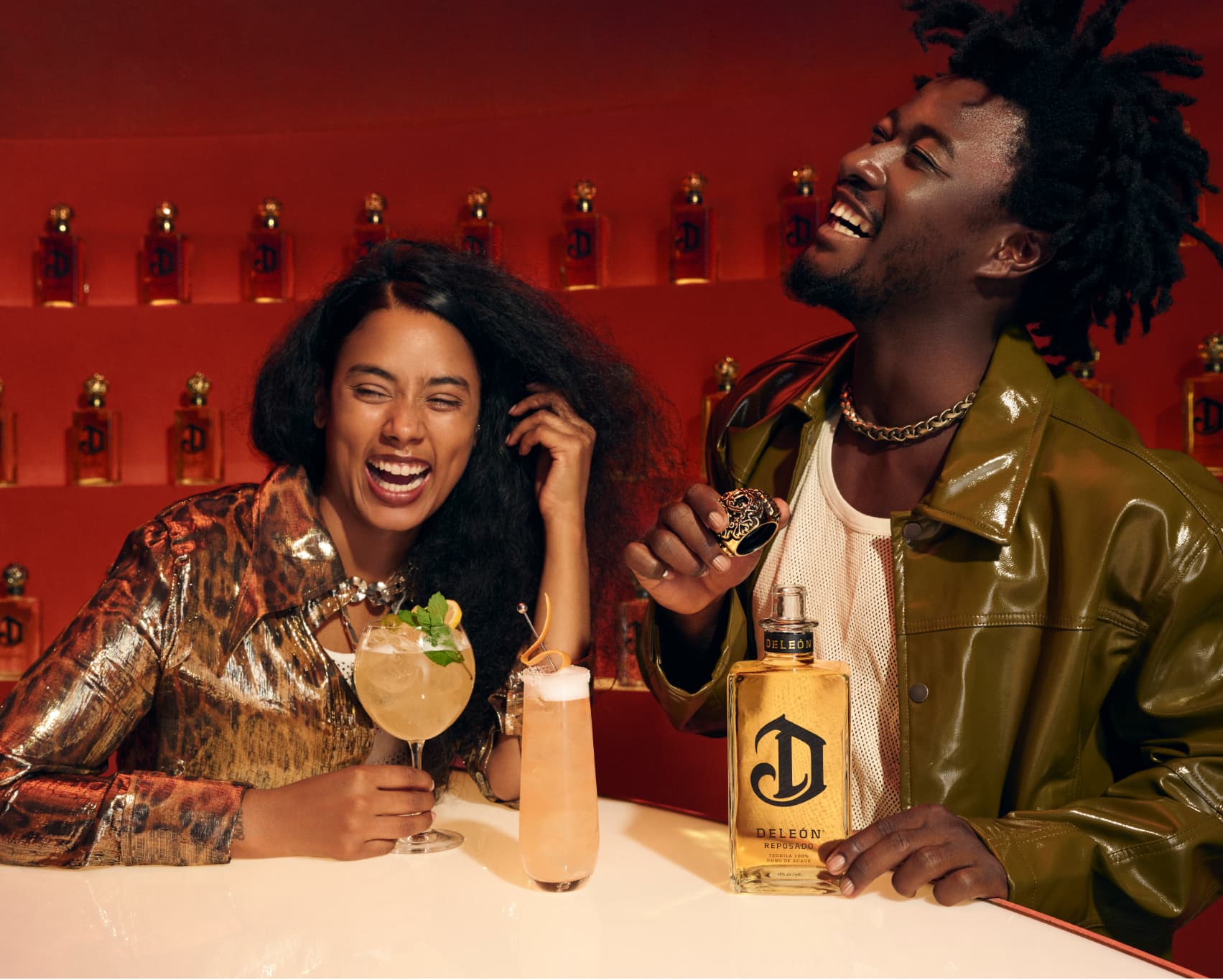 Two people enjoying a DeLeon cocktail